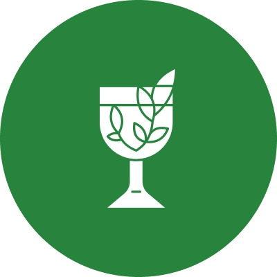 Here's an alt tag for the image: Green circle, wine glass, leaves.