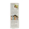 A box of toothpaste with the back side showing a woman and text.